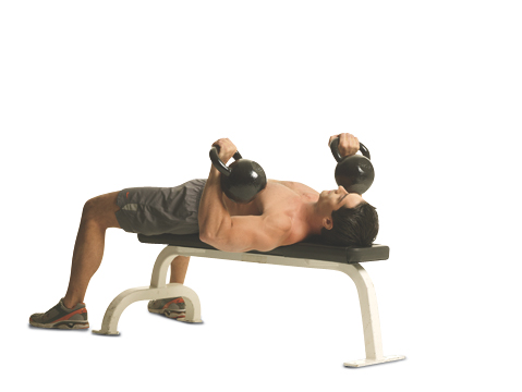 Picture of male doing chest exercises with a kettlebell.